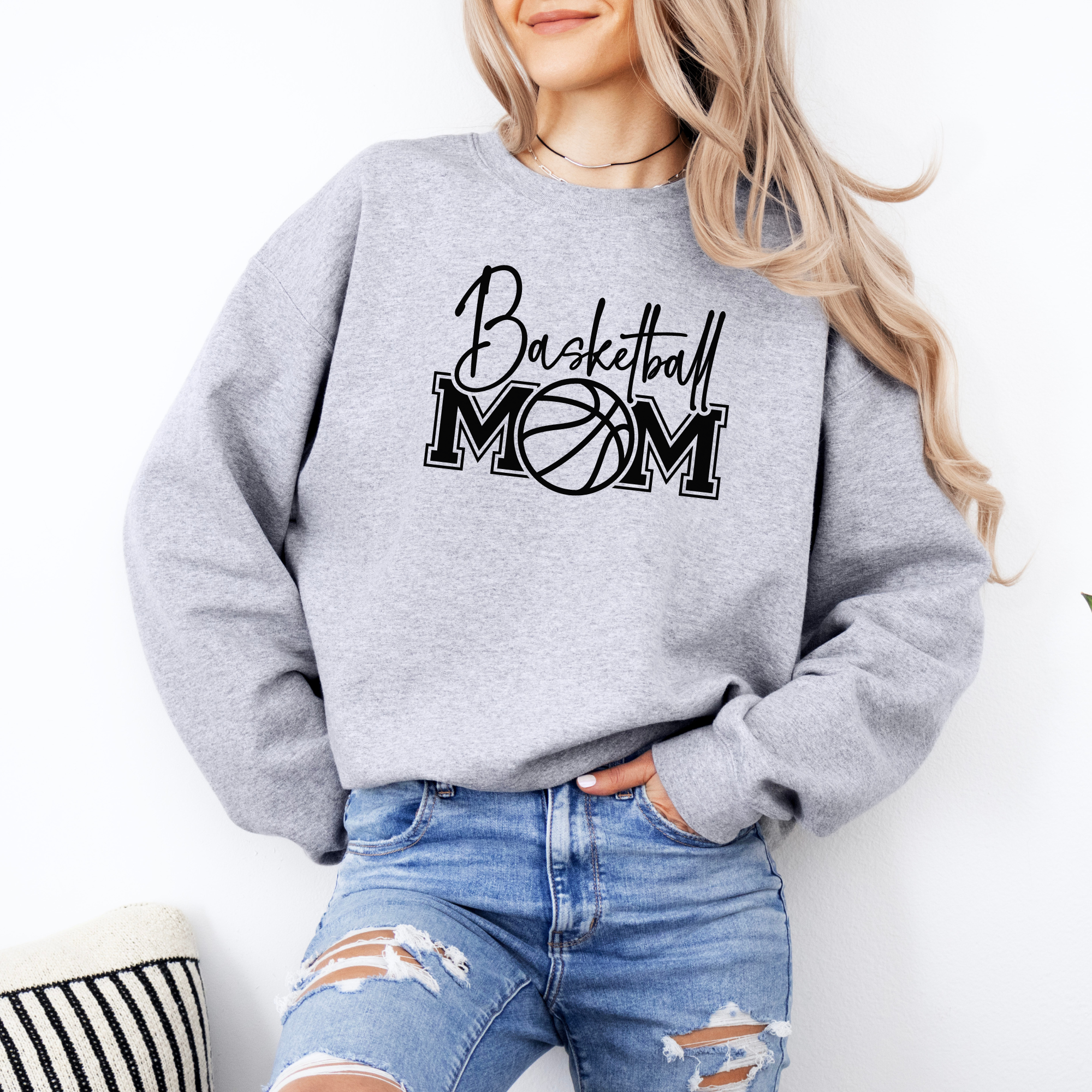 Basketball mom sweatshirt with a cute cursive font and a college text font. Great apparel for basketball games.