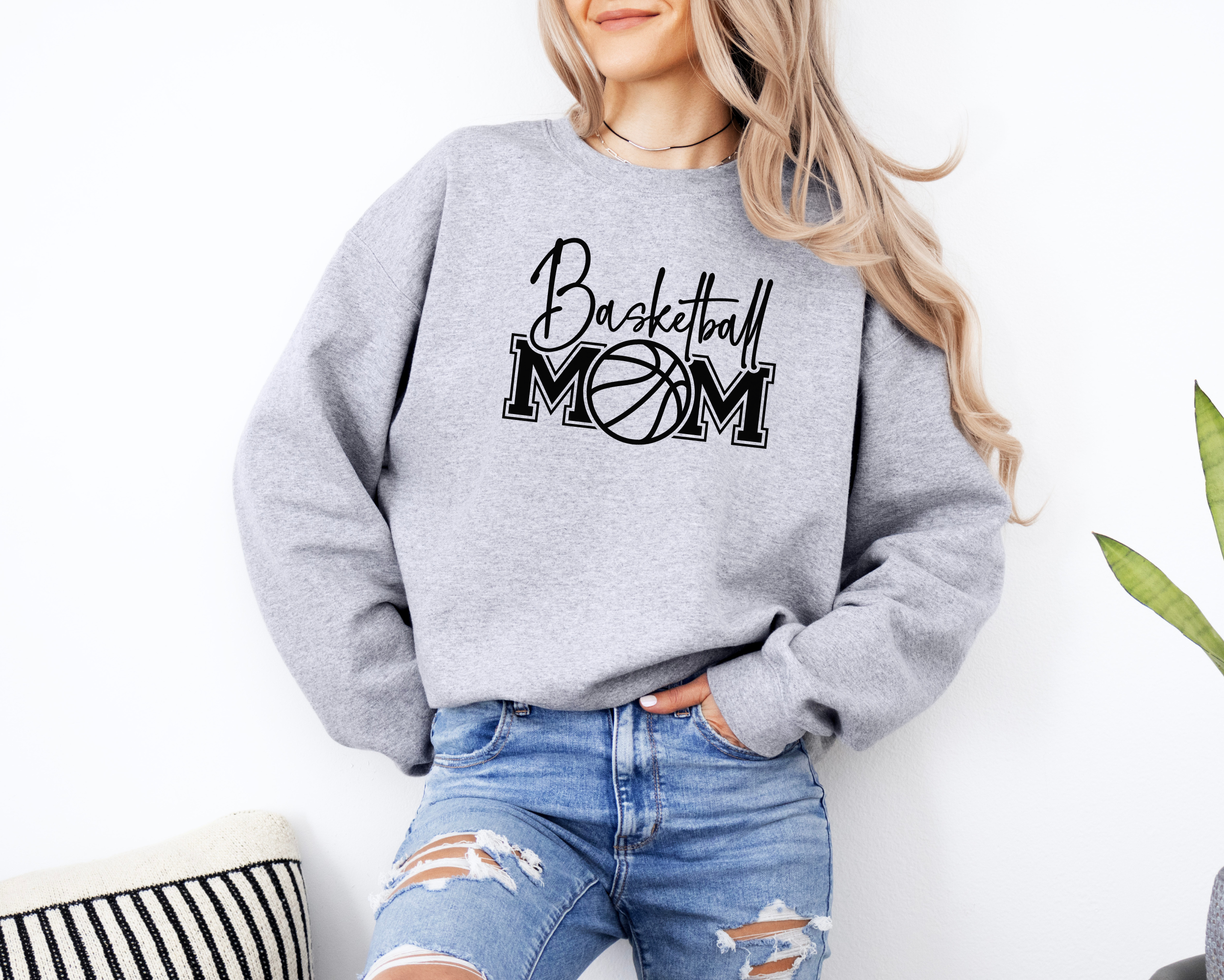 Basketball mom sweatshirt with a cute cursive font and a college text font. Great apparel for basketball games.