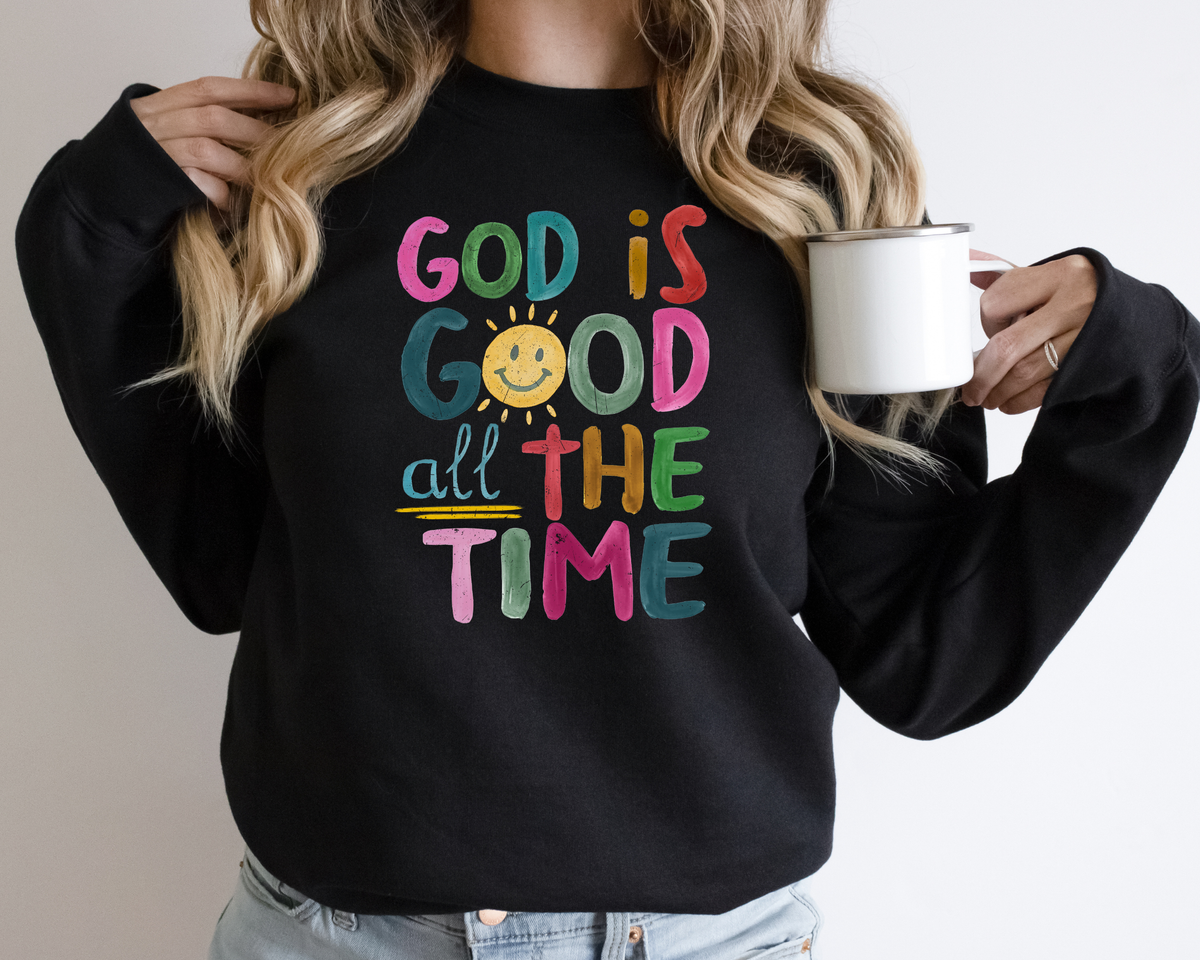 Black God is good shirt with a rainbow colored painted design that says "god is good all the time."