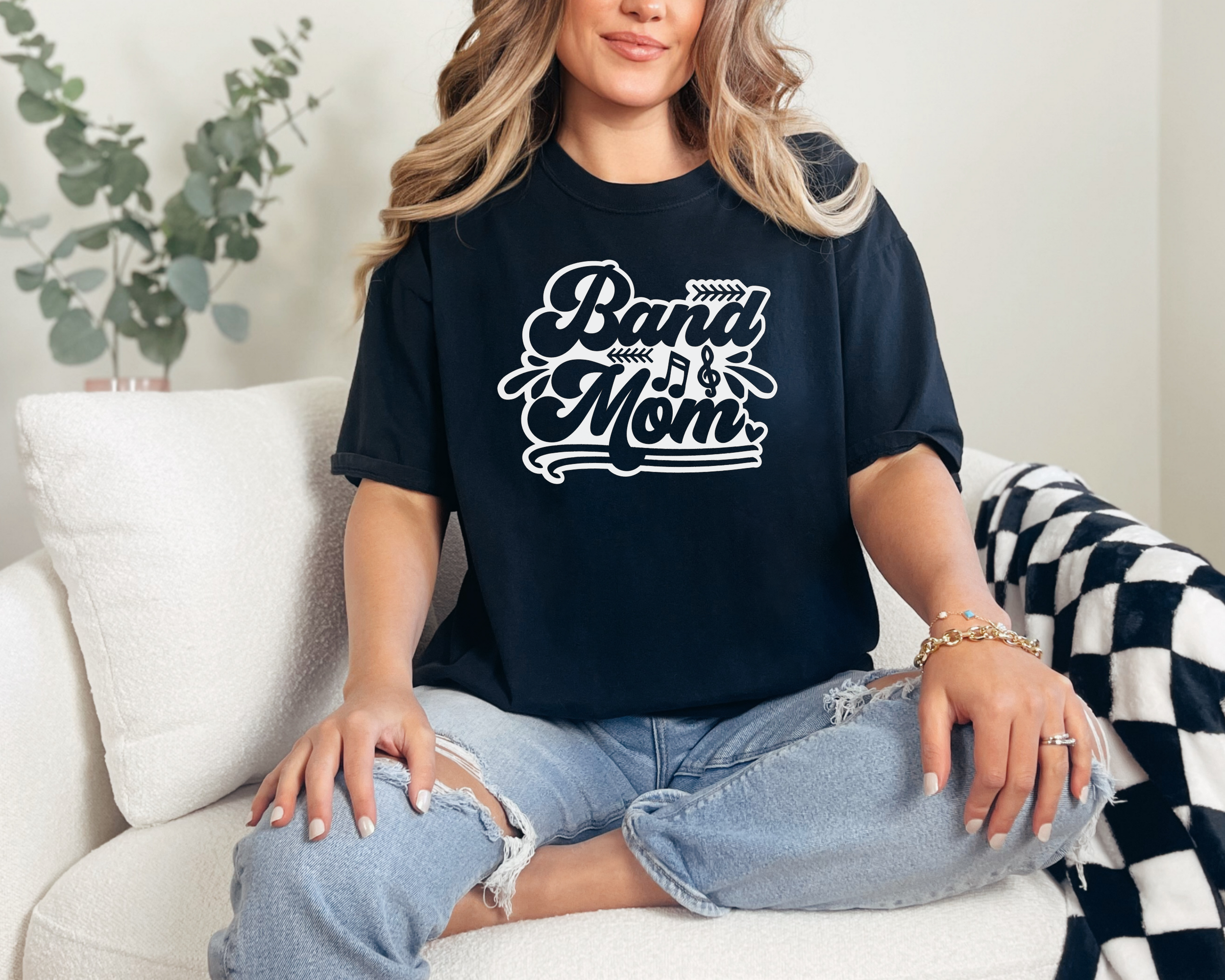 band mom tshirt made with a black comfort colors tee and white design. In a retro bubble text with music symbols.