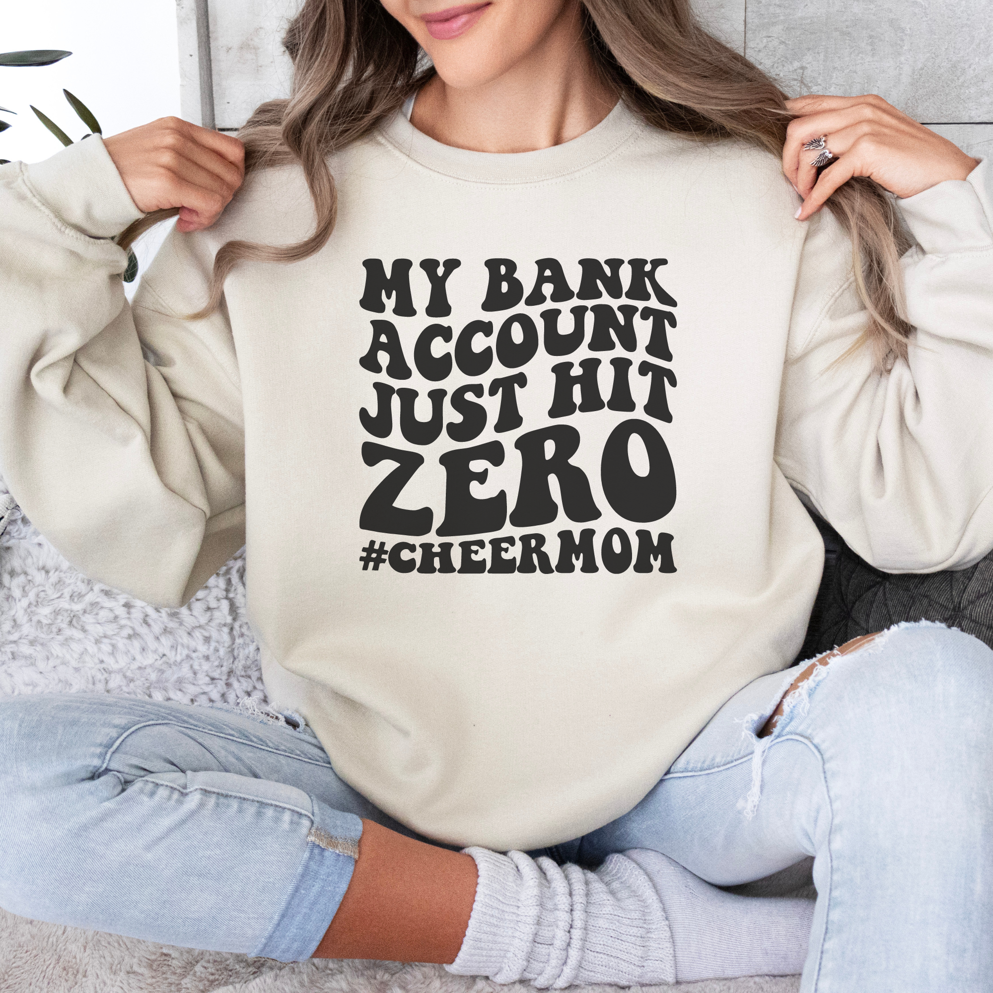 My bank account just hit zero cheer mom sweatshirt in sand.