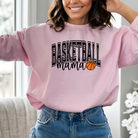 basketball mama sweatshirt with a college outline text , mama in cursive, and a small basketball