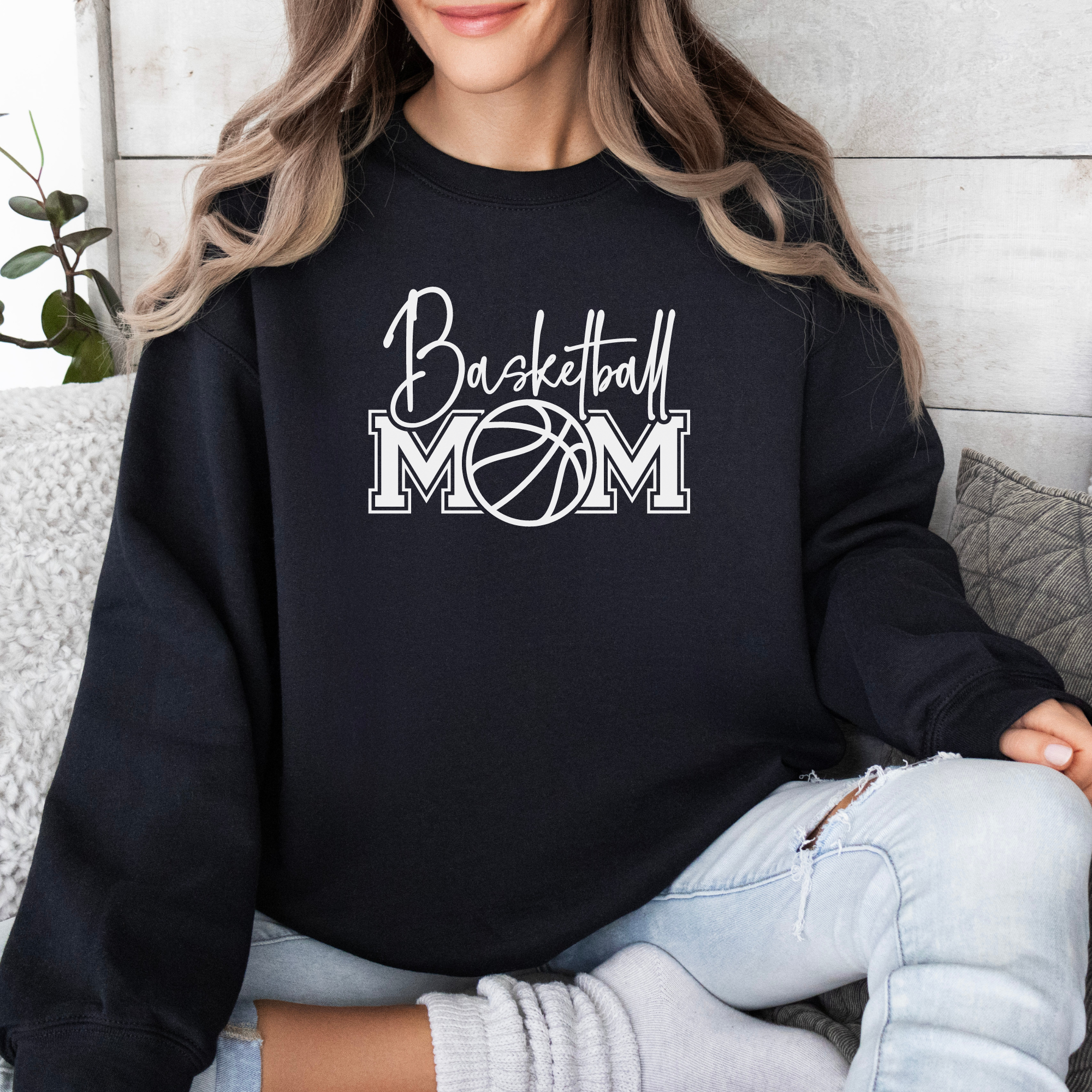 Basketball mom sweatshirt with a cute cursive font and a college text font. Great apparel for basketball games.
