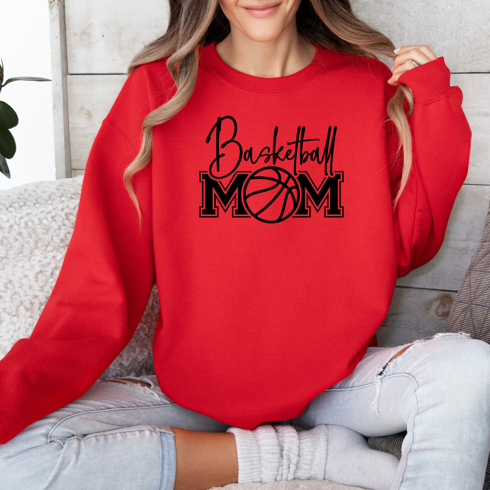 Basketball mom sweatshirt with a cute cursive font and a college text font. Great apparel for basketball games.
