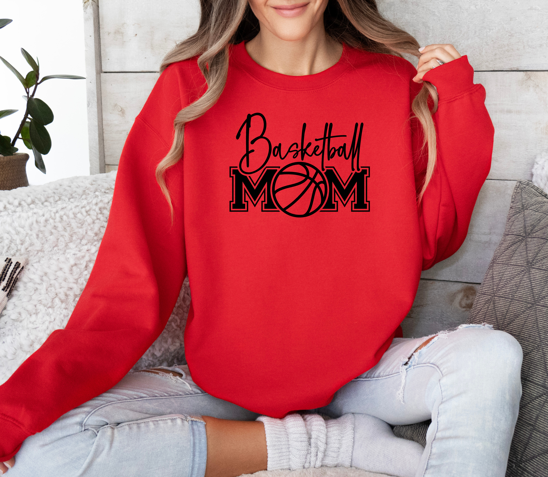 Basketball mom sweatshirt with a cute cursive font and a college text font. Great apparel for basketball games.