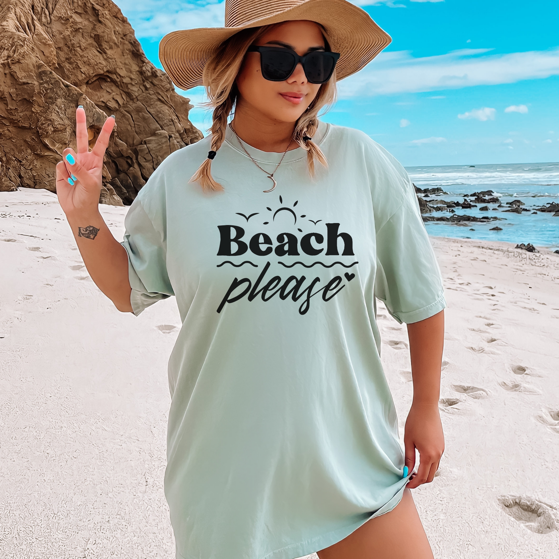 beach shirt that says beach please. Subtle smaller designs around the words are bird sun waves and heart. Made in the color bay in a comfort colors tee.