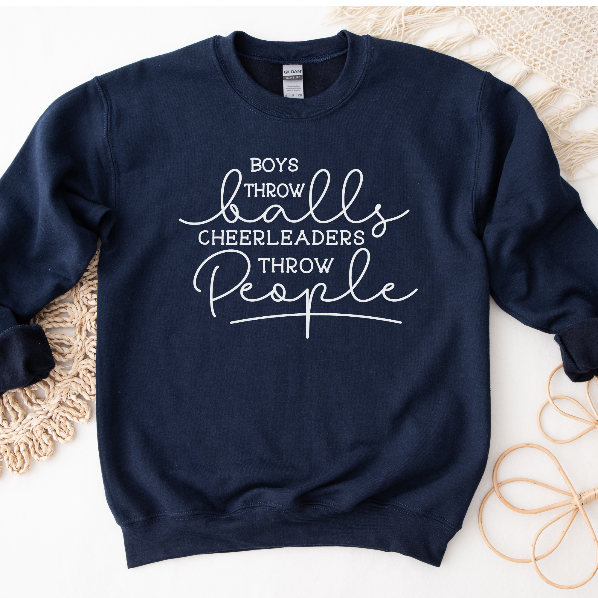 Funny cheer sweatshirt that says boys throw balls cheerleaders throw people in navy