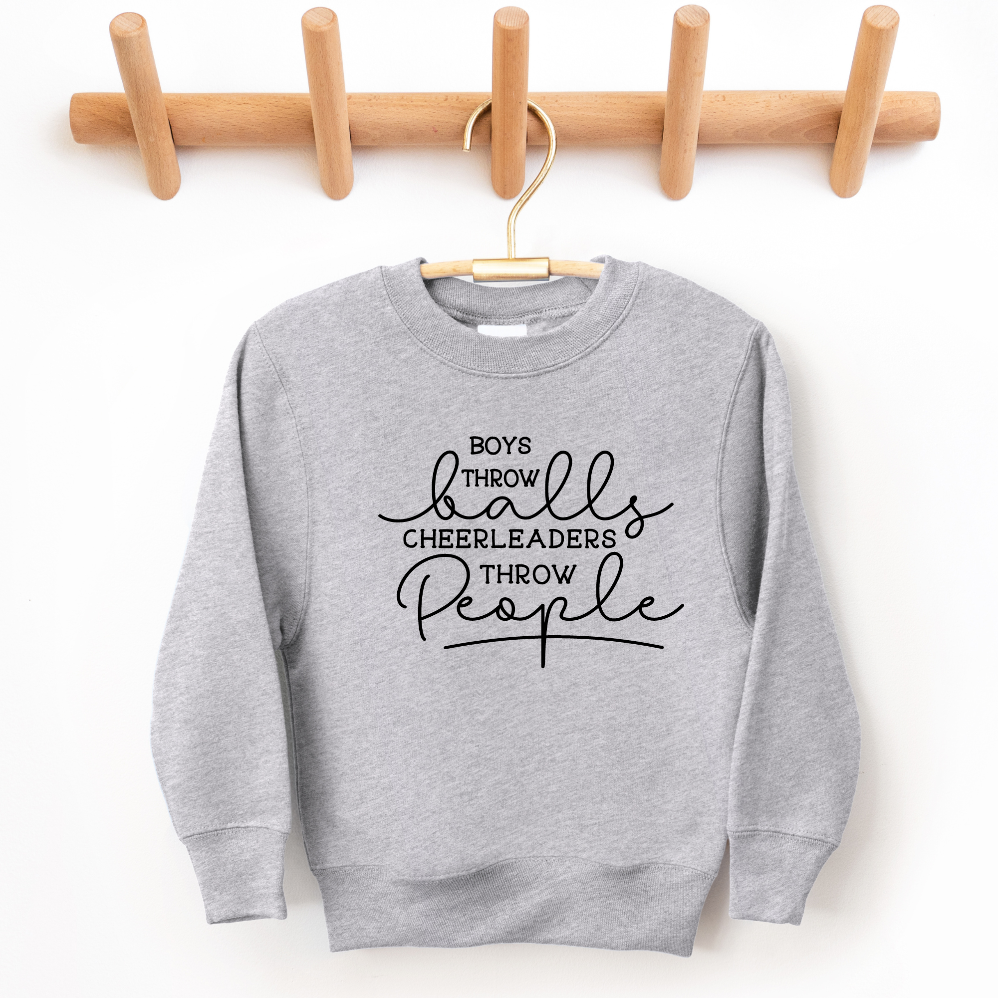 Funny cheer sweatshirt that says boys throw balls cheerleaders throw people in gray