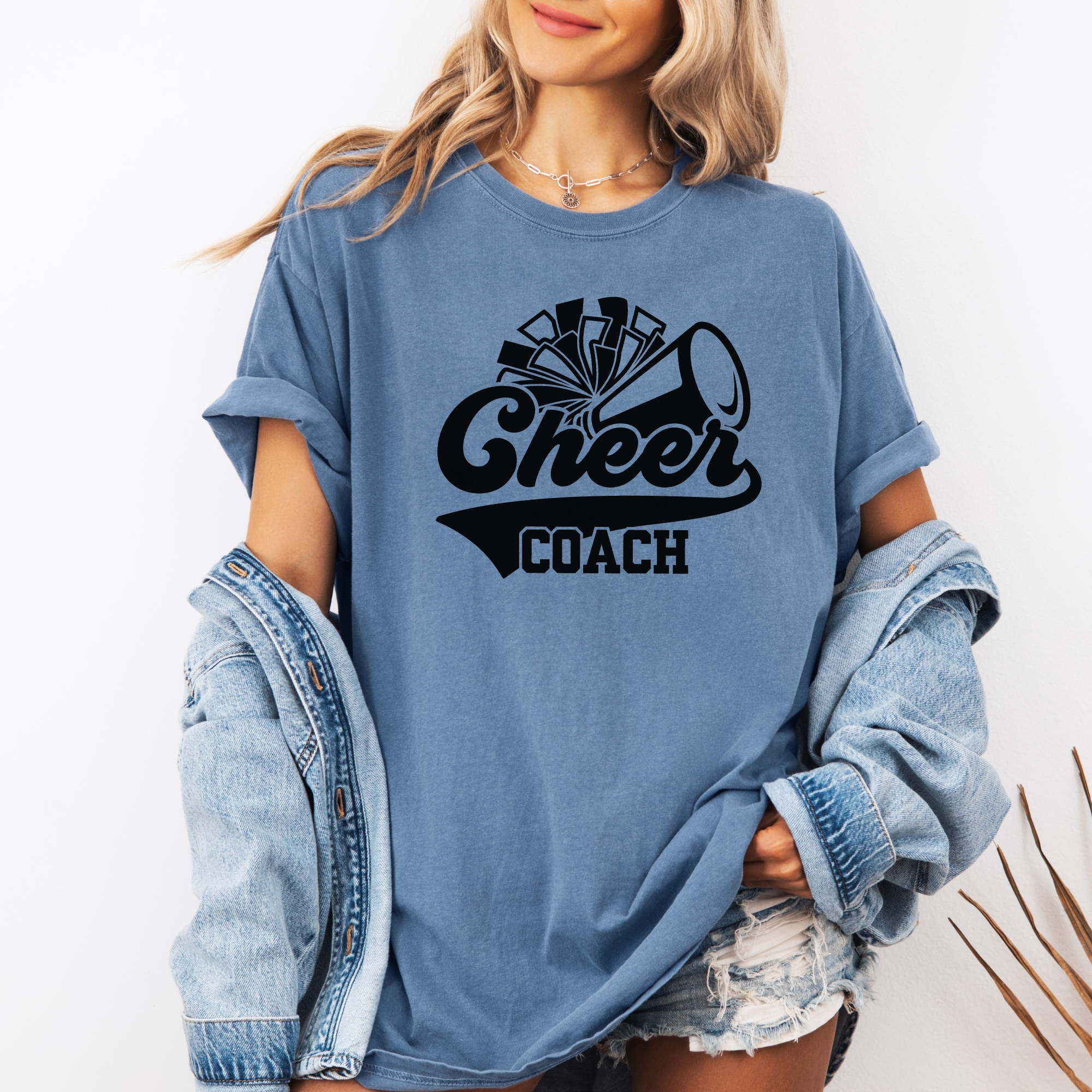 Retro cheer coach shirt with a pom pom and a megaphone.