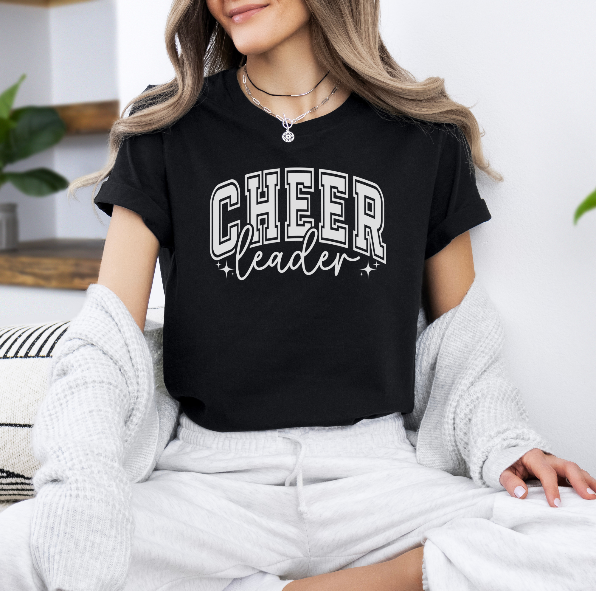 varsity college text cheerleader shirt in black.