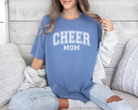 Cheer mom shirt in a college outline text in the color blue with white design.