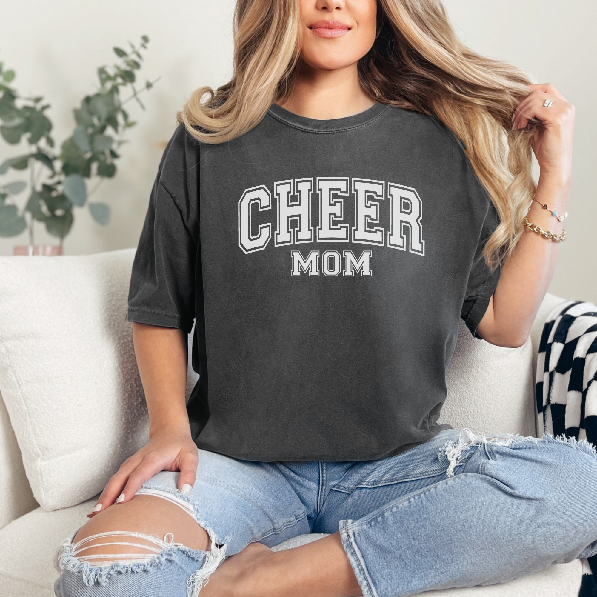 Cheer mom shirt in a college outline text in the color pepper