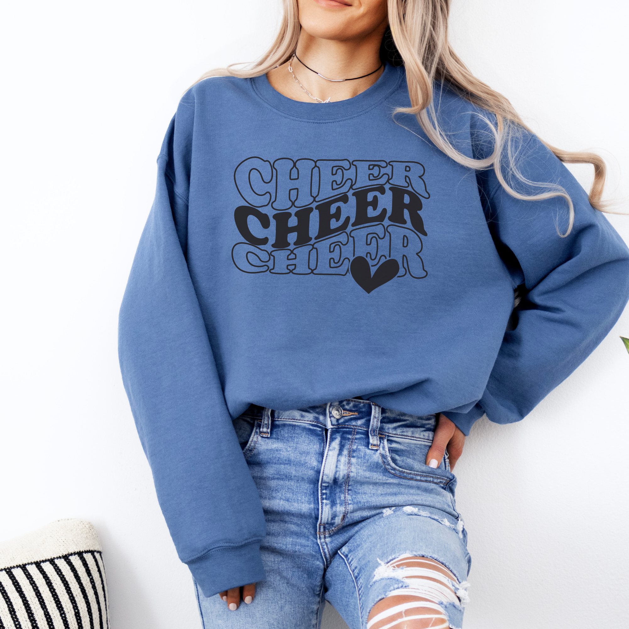 Indigo Cheer sweatshirt in in a wavy stacked text with a heart.