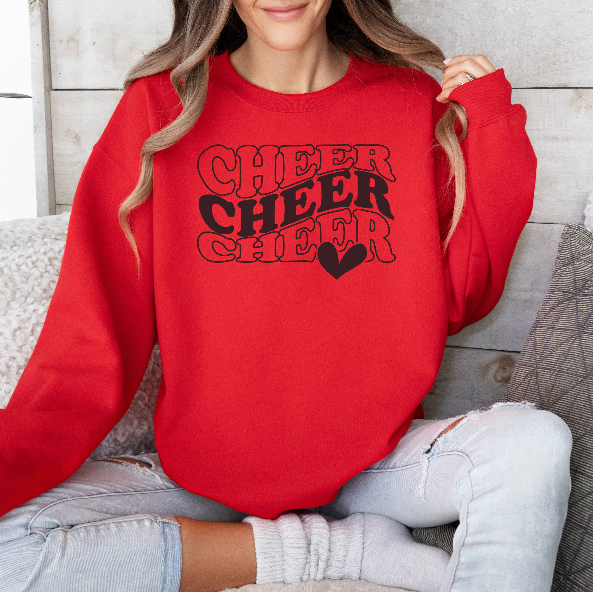 Red Cheer sweatshirt in in a wavy stacked text with a heart.
