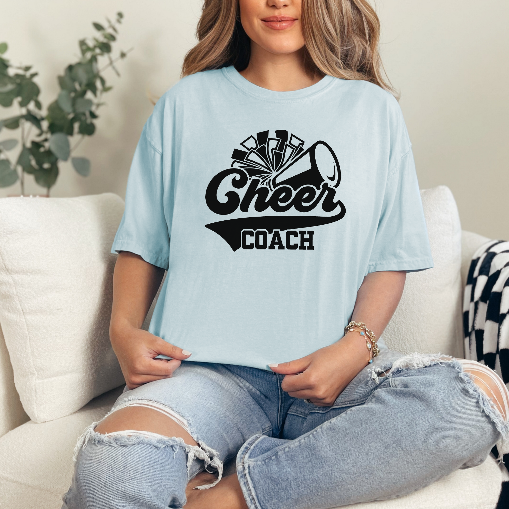 Retro cheer coach shirt with a pom pom and a megaphone.
