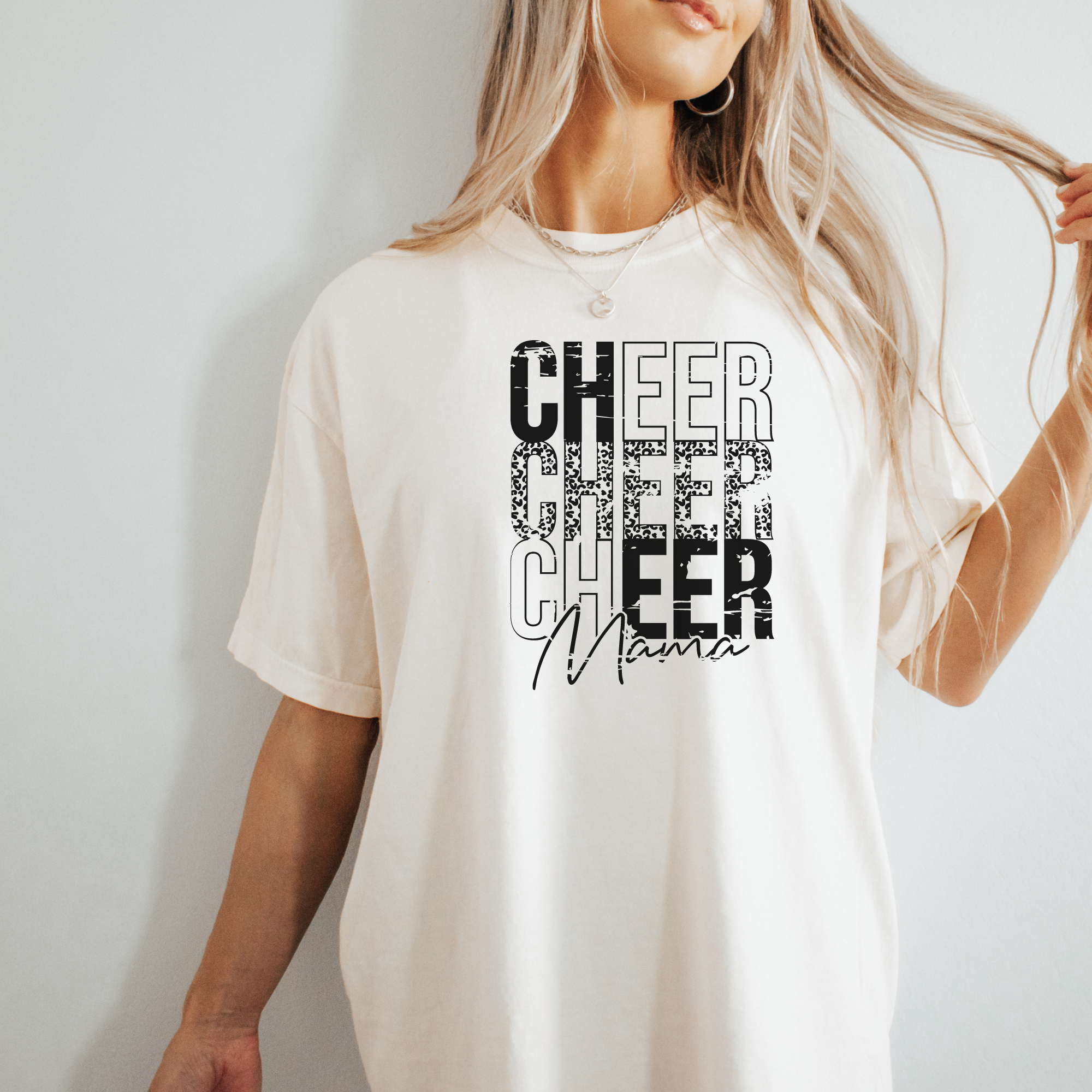 cheer mama stacked tshirt with a distressed cheetah print design in the color ivory