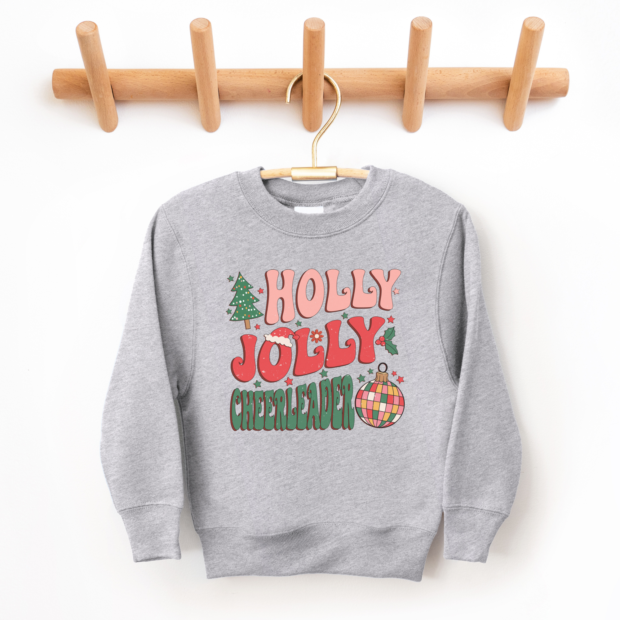 Holly jolly cheerleader sweatshirt for Christmas.  Sized for toddlers, kids, and teens.