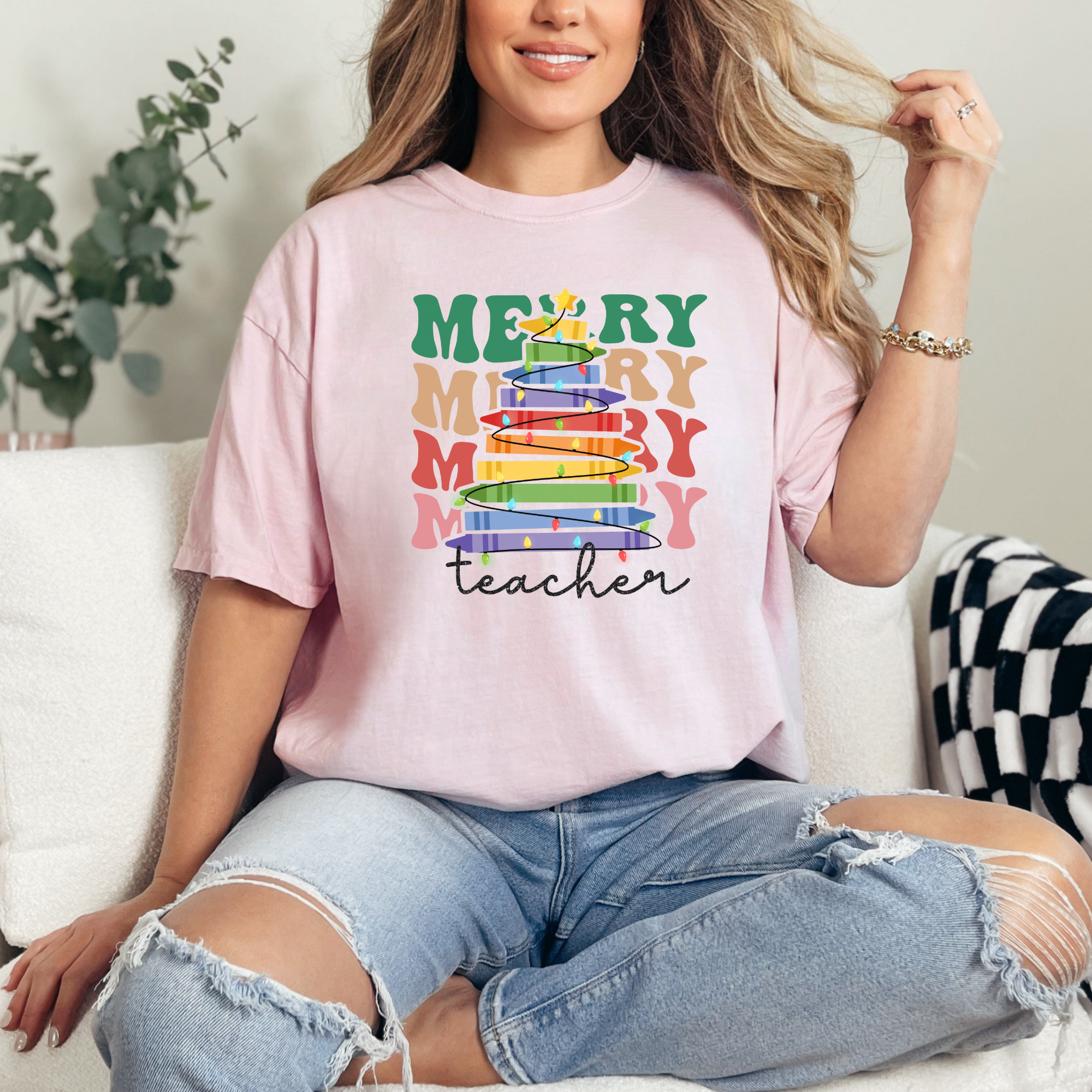 Cute Christmas tshirt for teachers that says merry teacher stacked with a crayon tree.