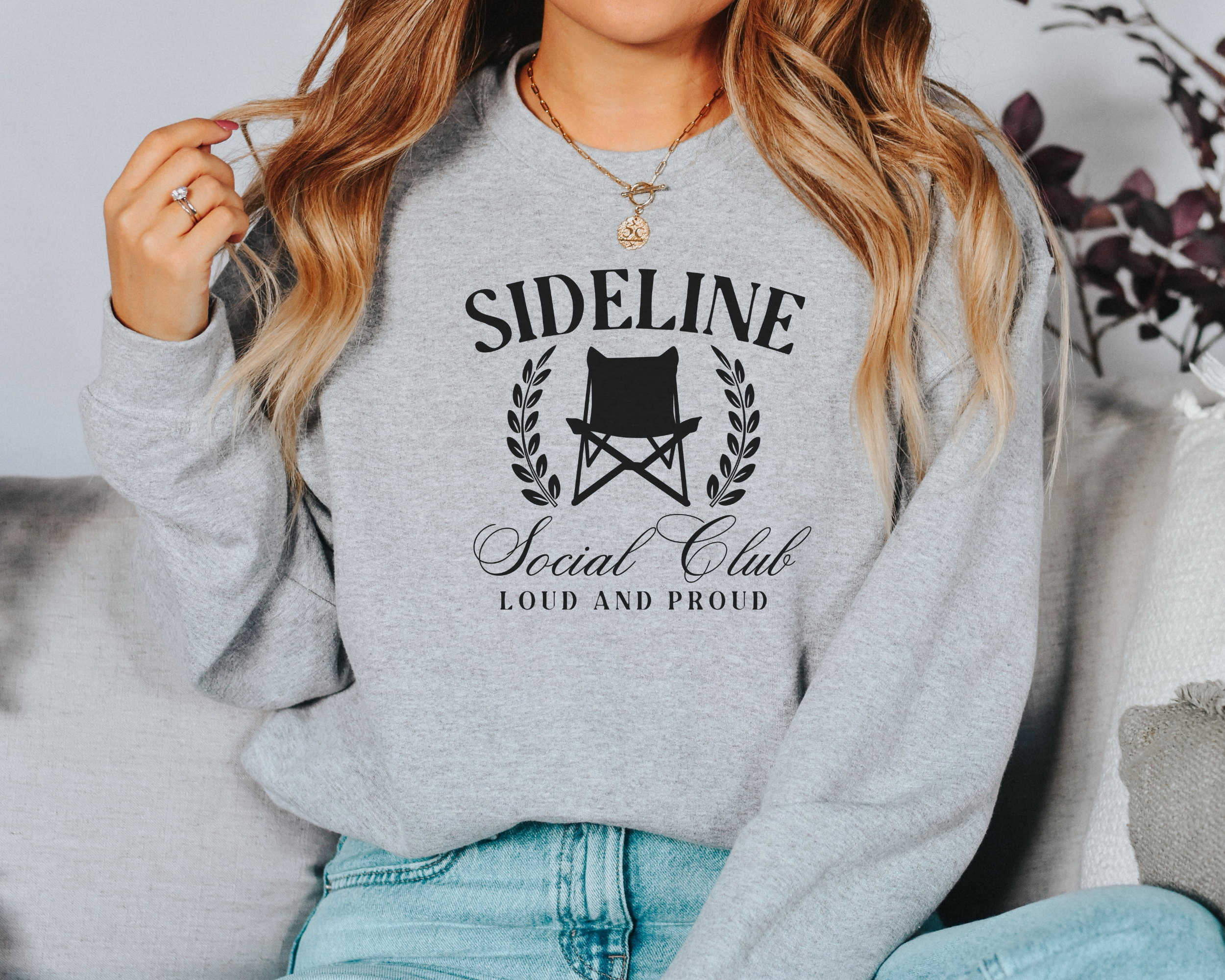 sports mom sweatshirt that says sideline social club loud and proud.