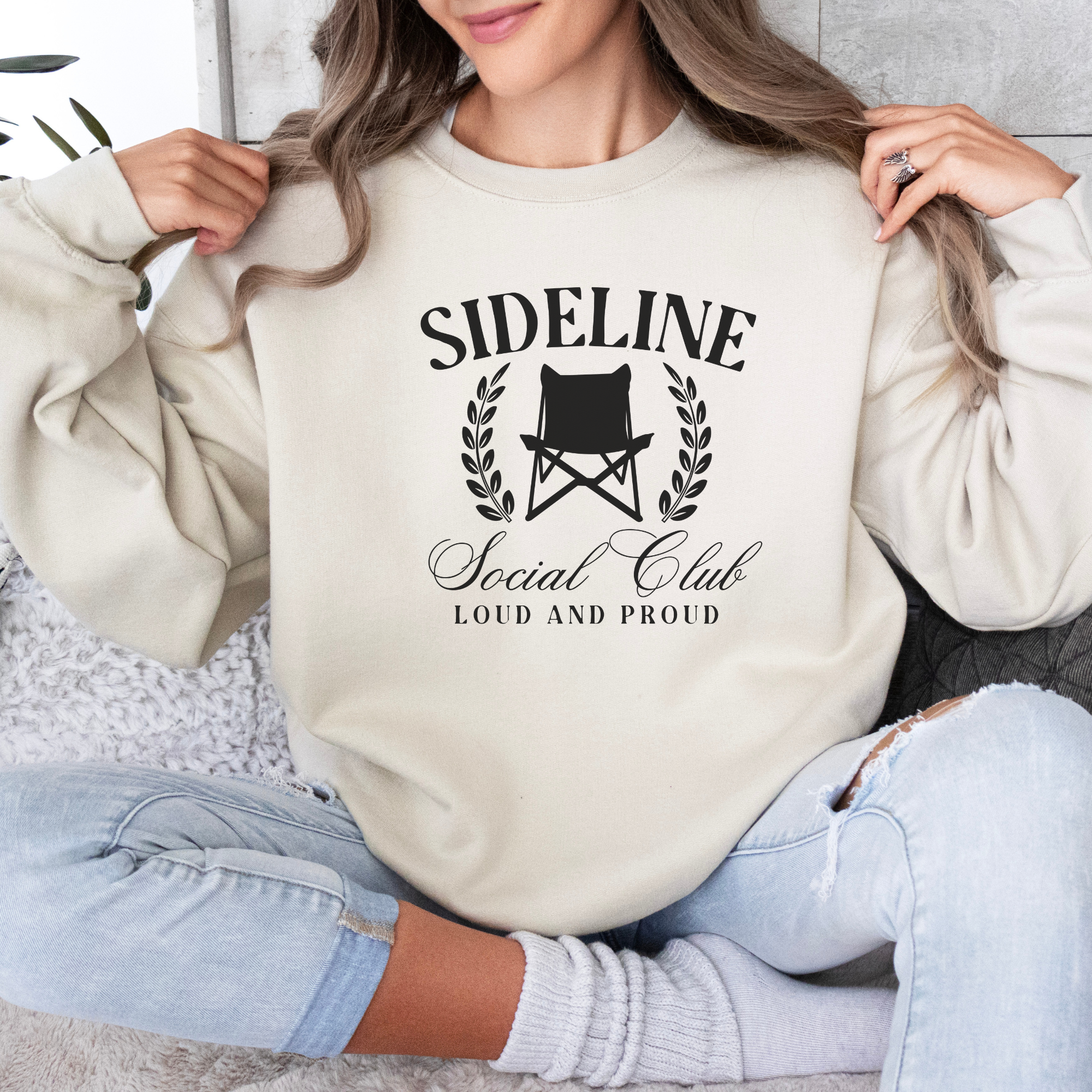 sports mom sweatshirt that says sideline social club loud and proud.