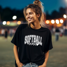 softball mama tshirt in black with white design.  Softball is in a college outline style text and mama is in cursive with a heart attached to the end.
