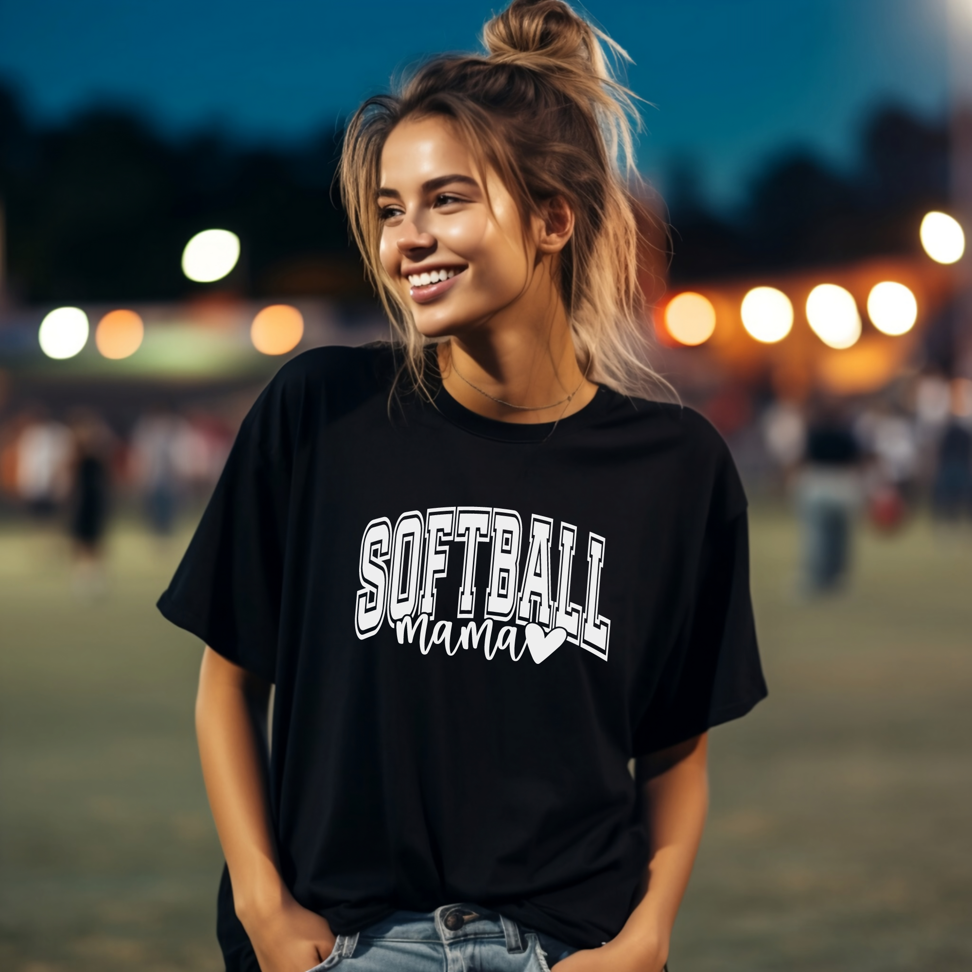 softball mama tshirt in black with white design. Softball is in a college outline style text and mama is in cursive with a heart attached to the end.