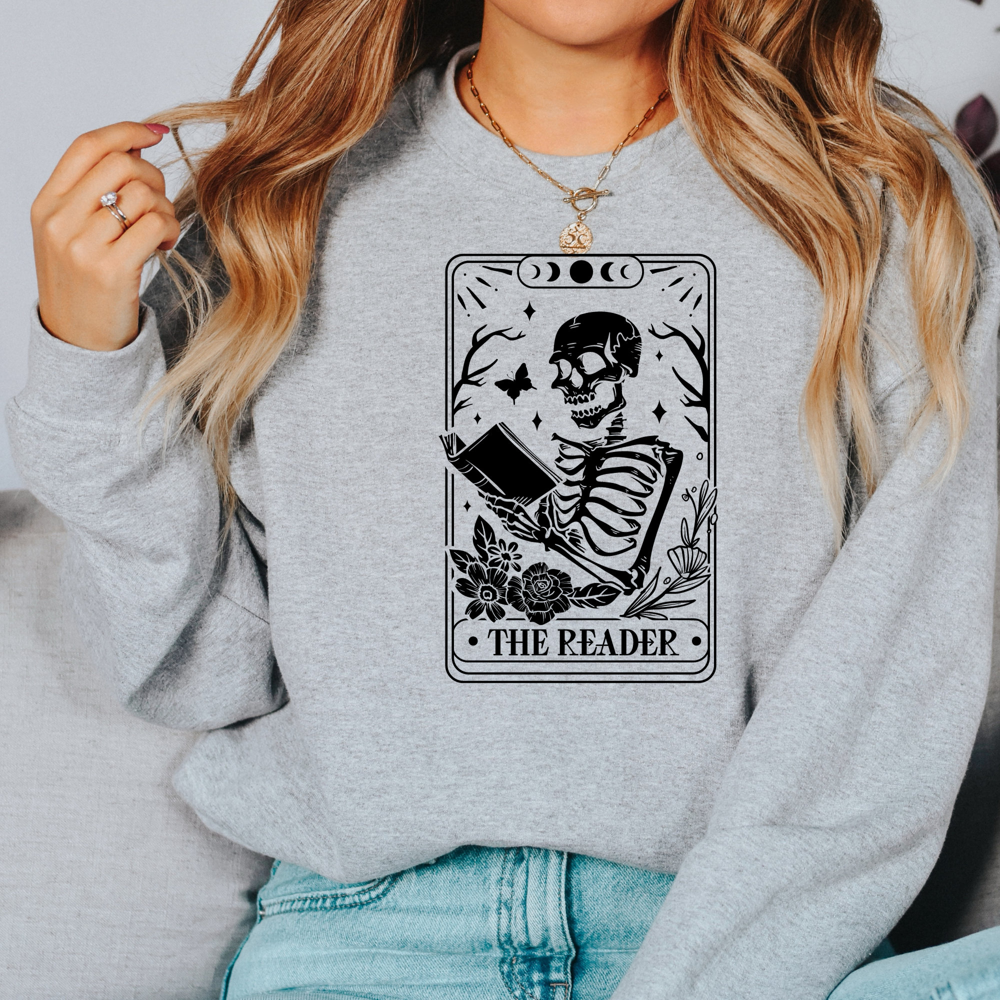 Book lover sweatshirt that features a tarot card that says the reader.  Women's sweatshirt.