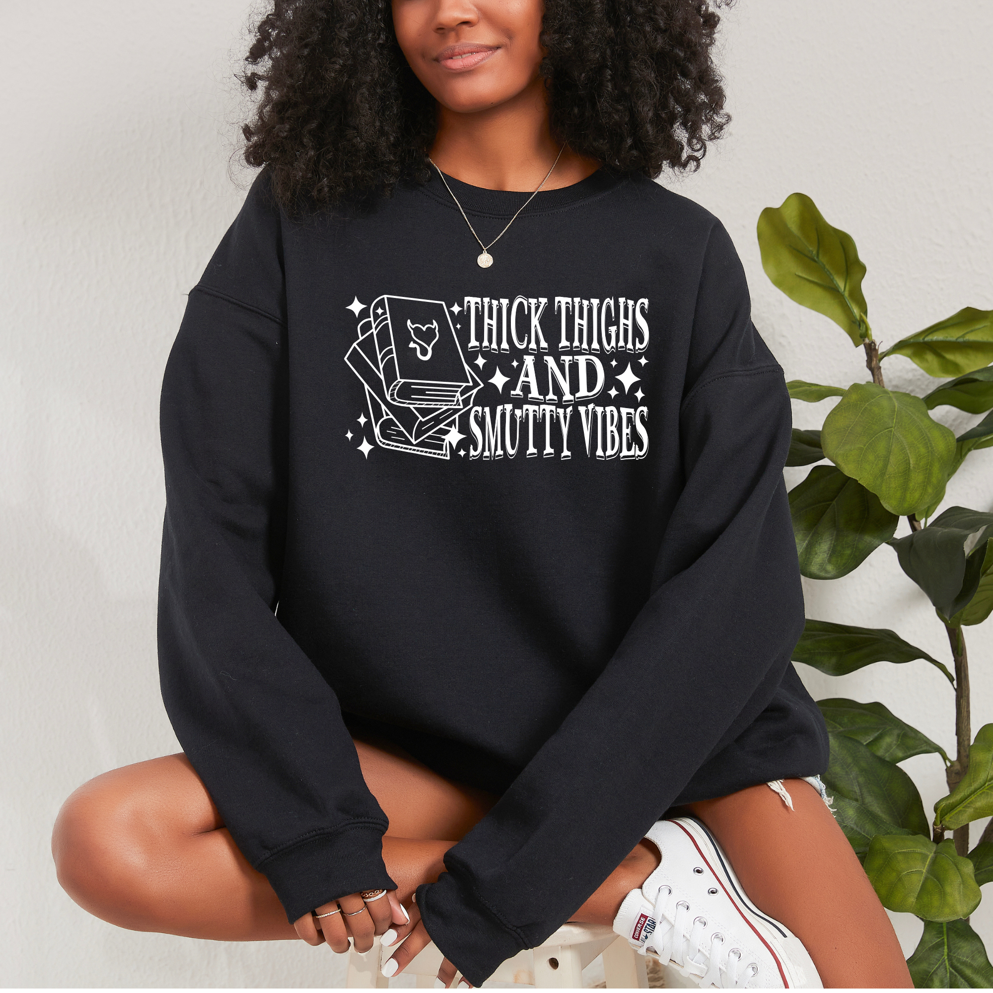 book lover sweatshirt that says thick thighs and smutty vibes