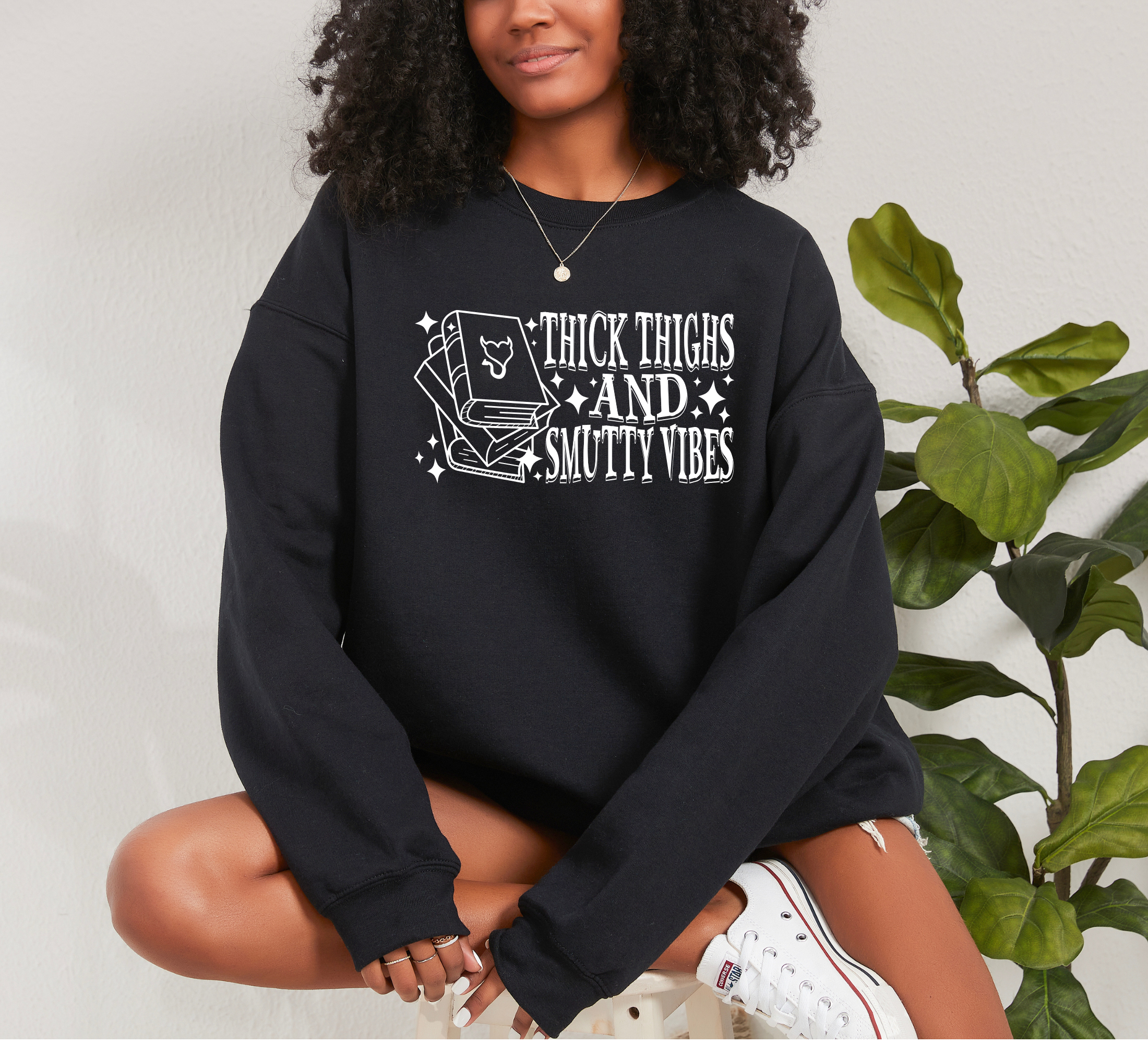book lover sweatshirt that says thick thighs and smutty vibes
