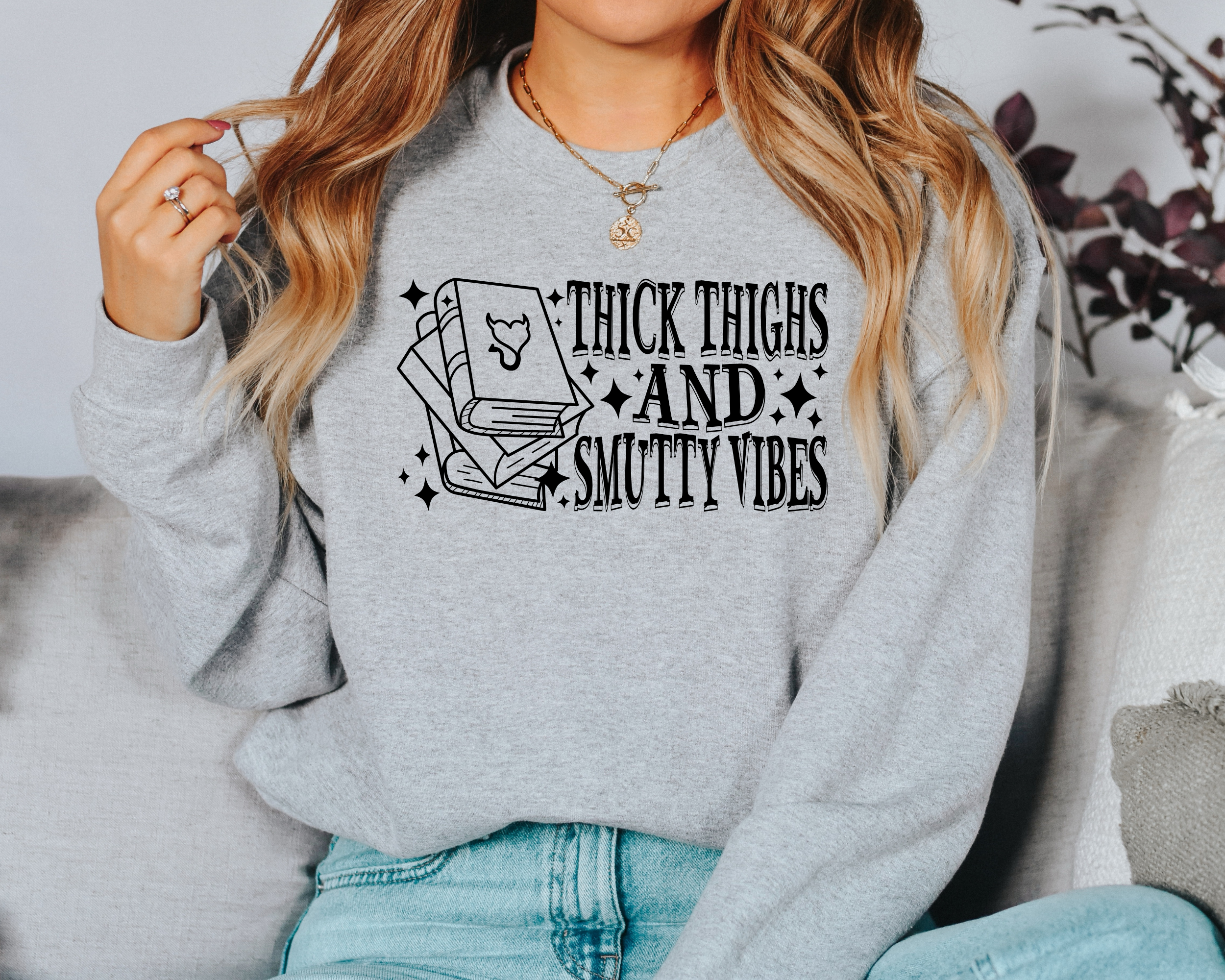 book lover sweatshirt that says thick thighs and smutty vibes