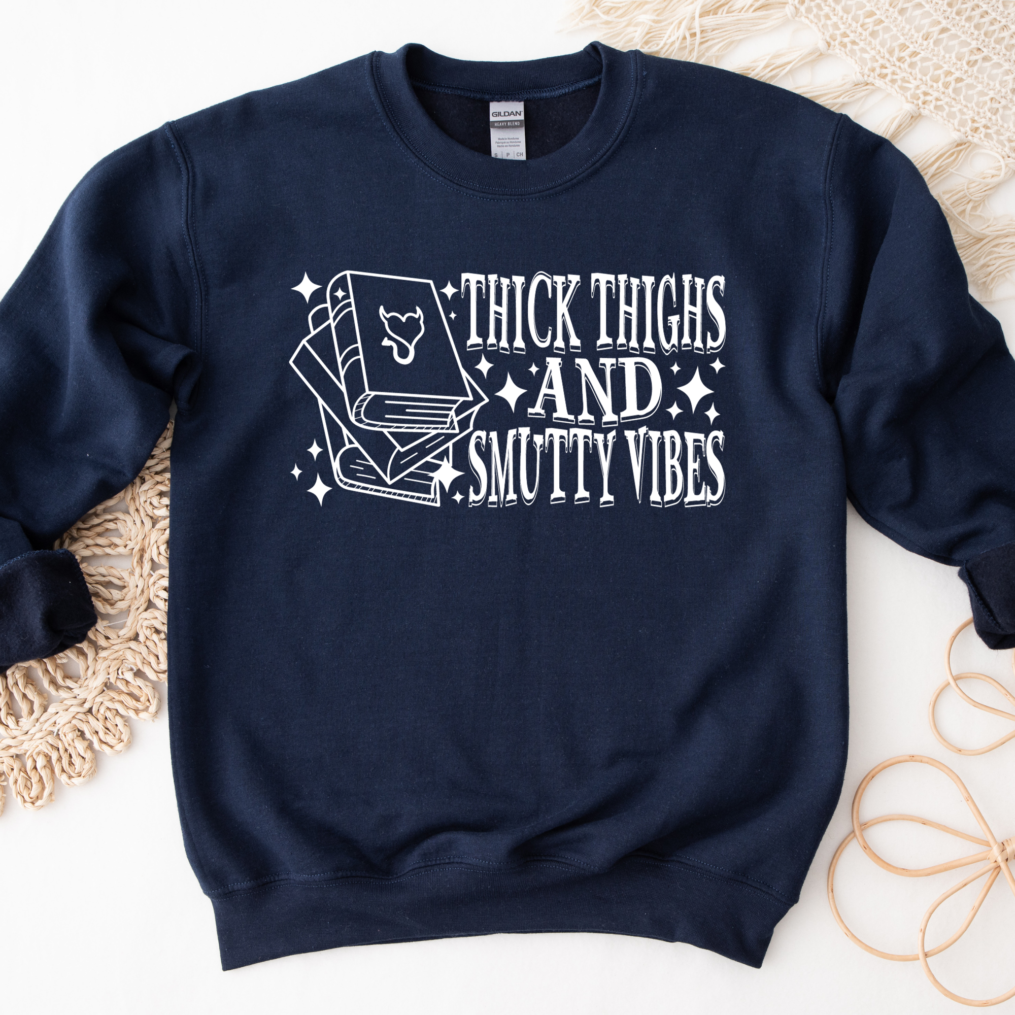 book lover sweatshirt that says thick thighs and smutty vibes