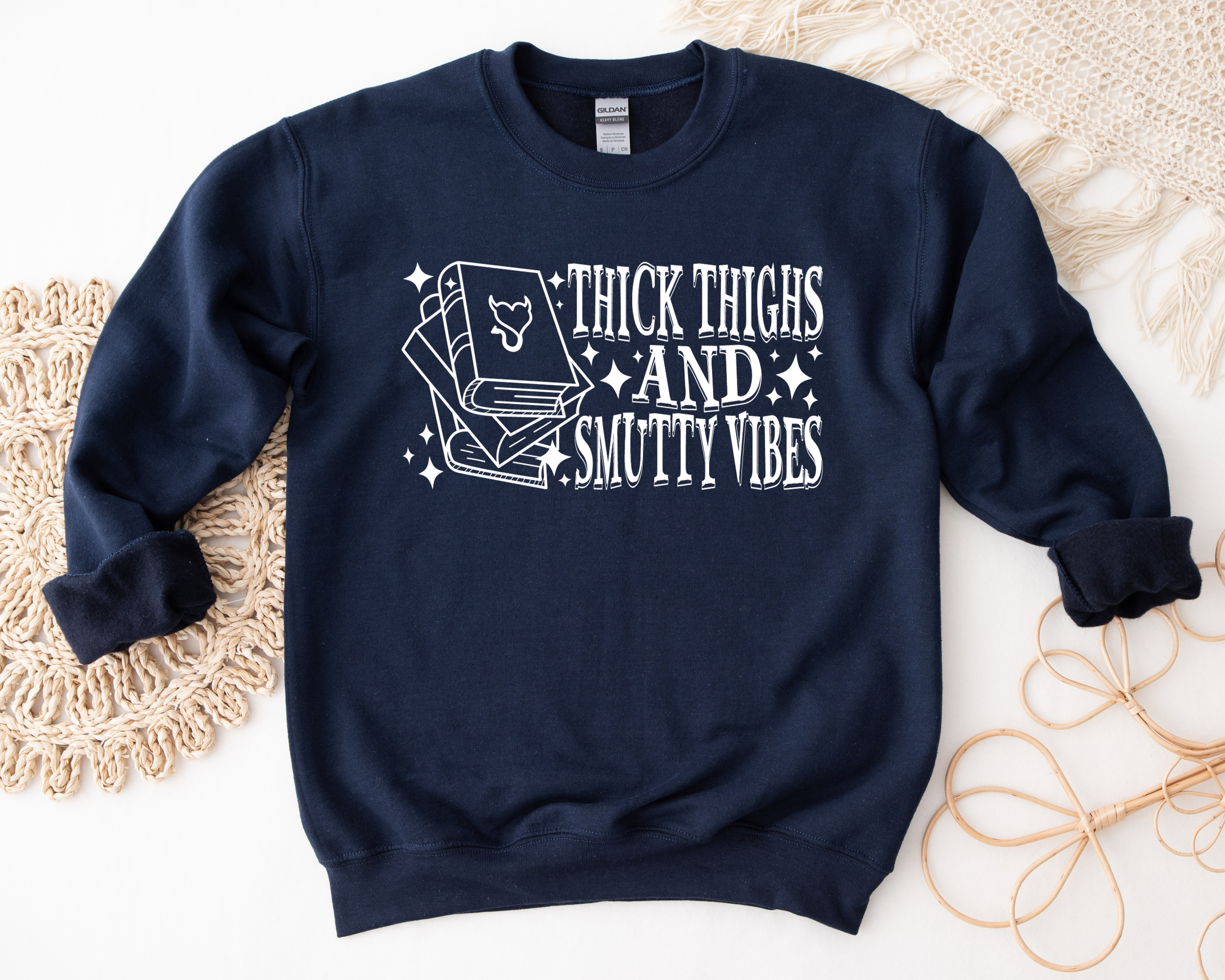 book lover sweatshirt that says thick thighs and smutty vibes