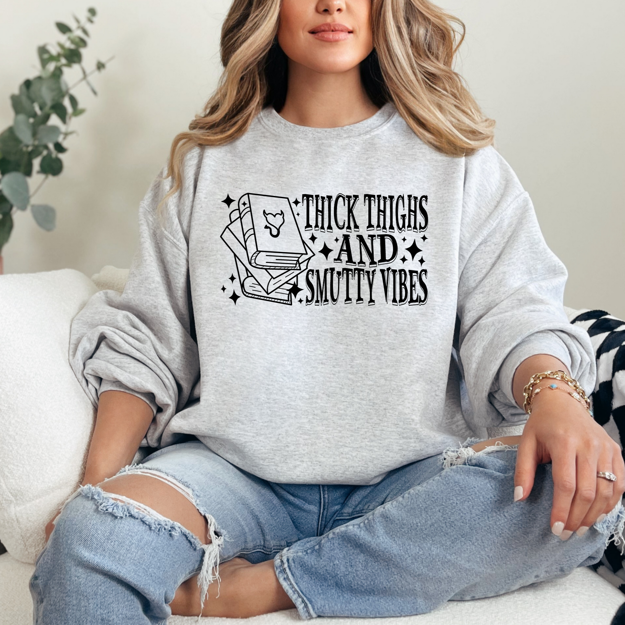 book lover sweatshirt that says thick thighs and smutty vibes