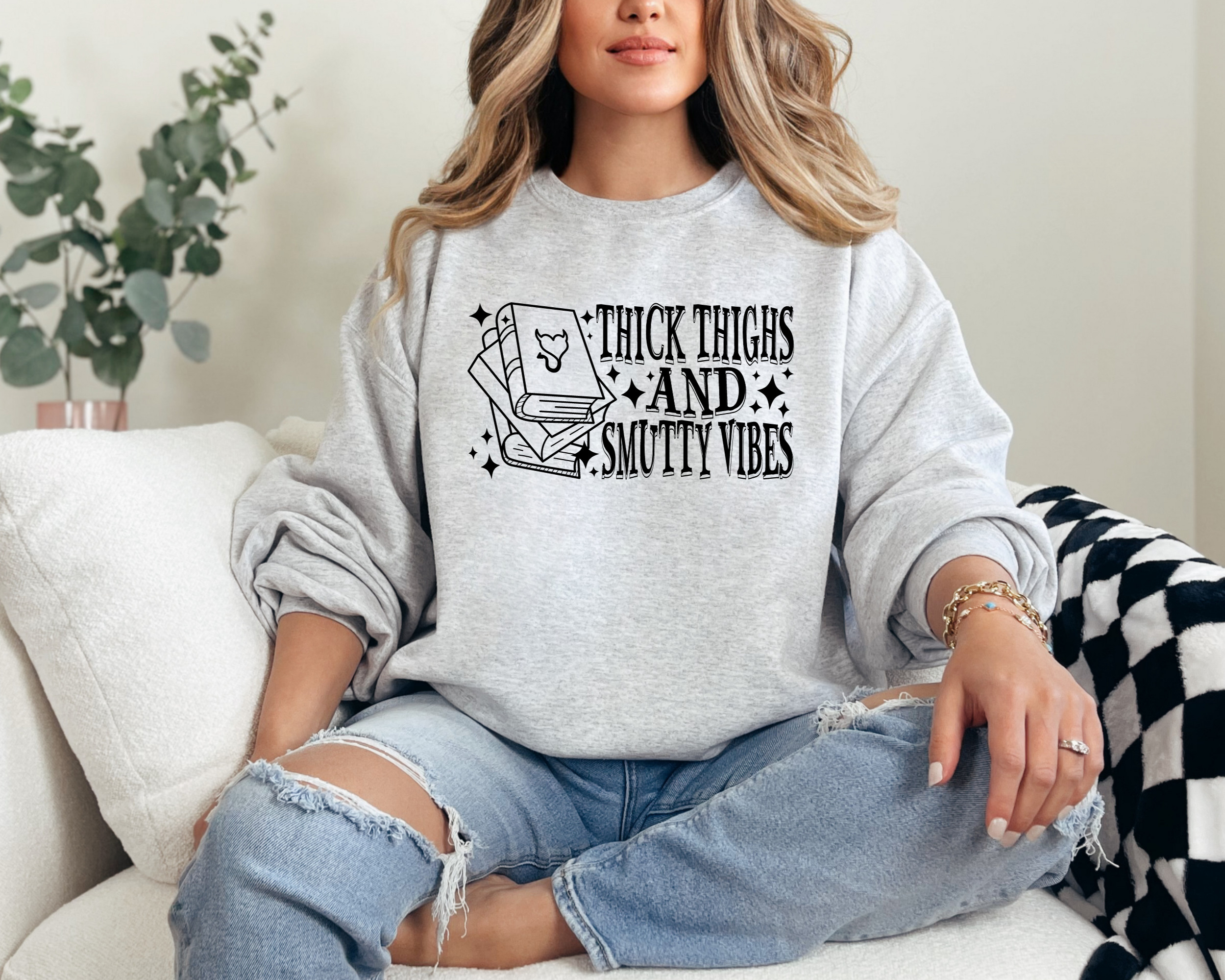 book lover sweatshirt that says thick thighs and smutty vibes