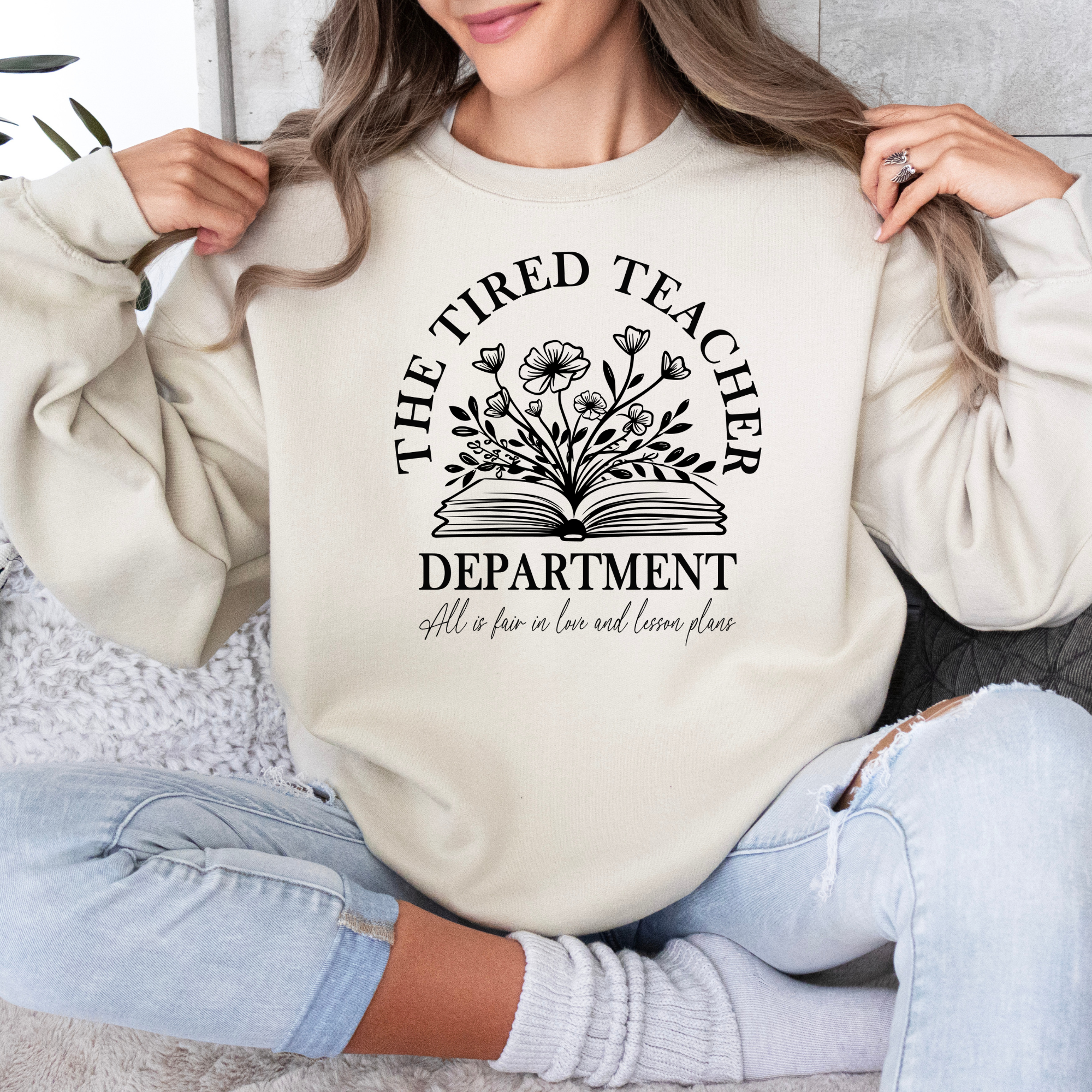 The tired teachers department sweatshirt