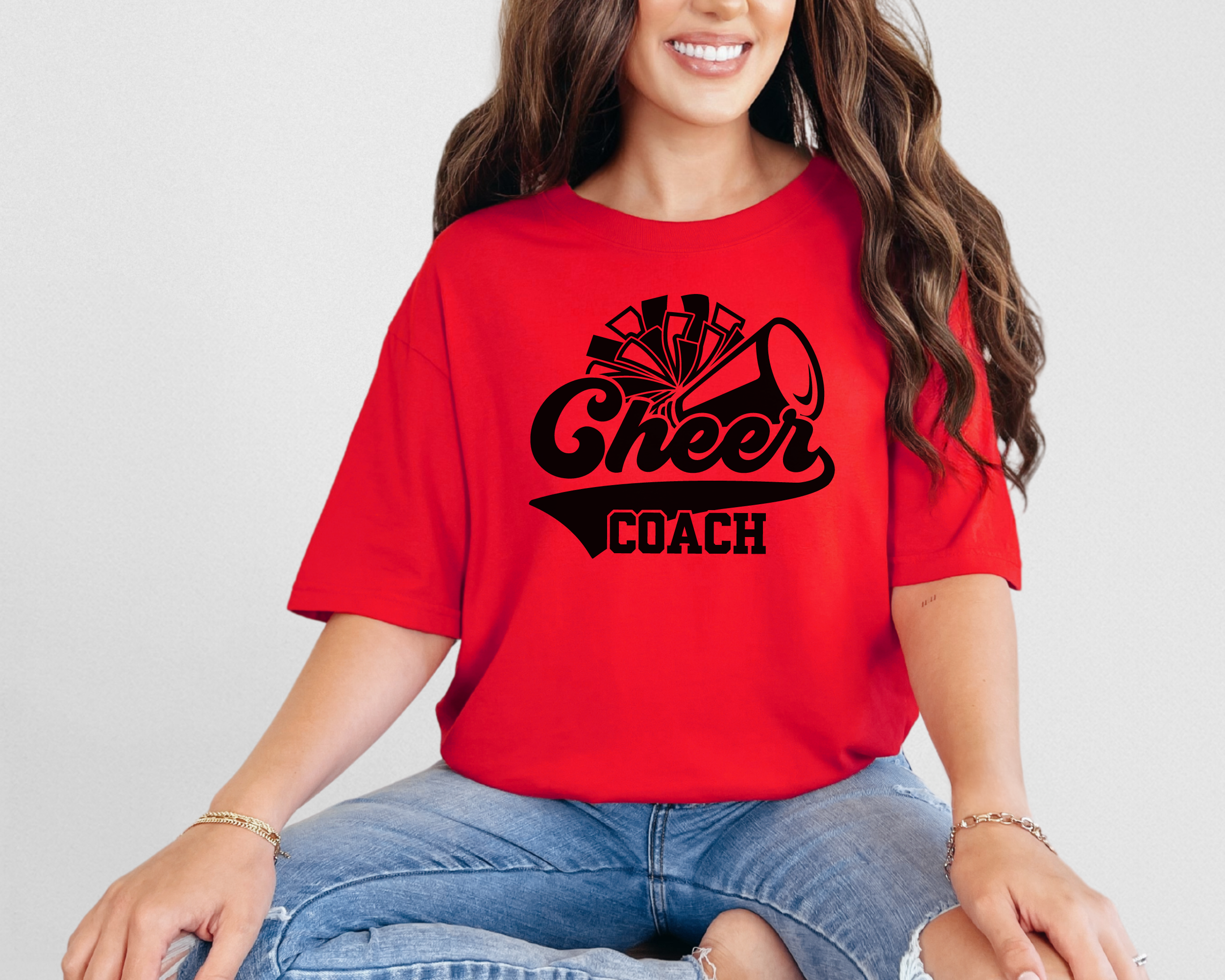 Retro cheer coach shirt with a pom pom and a megaphone.