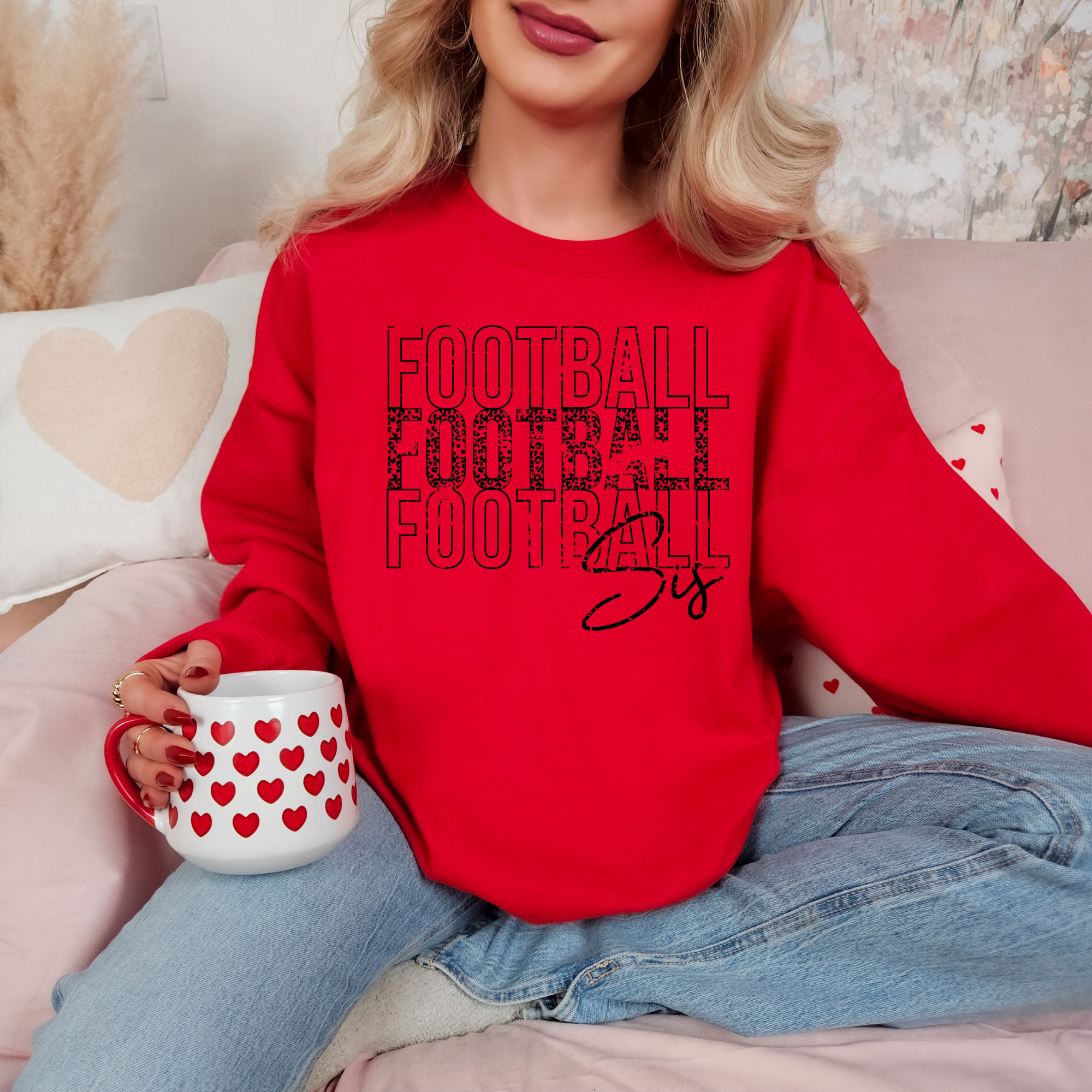 football sister sweatshirt in a stacked design.  Sweatshirt is red and design is black.
