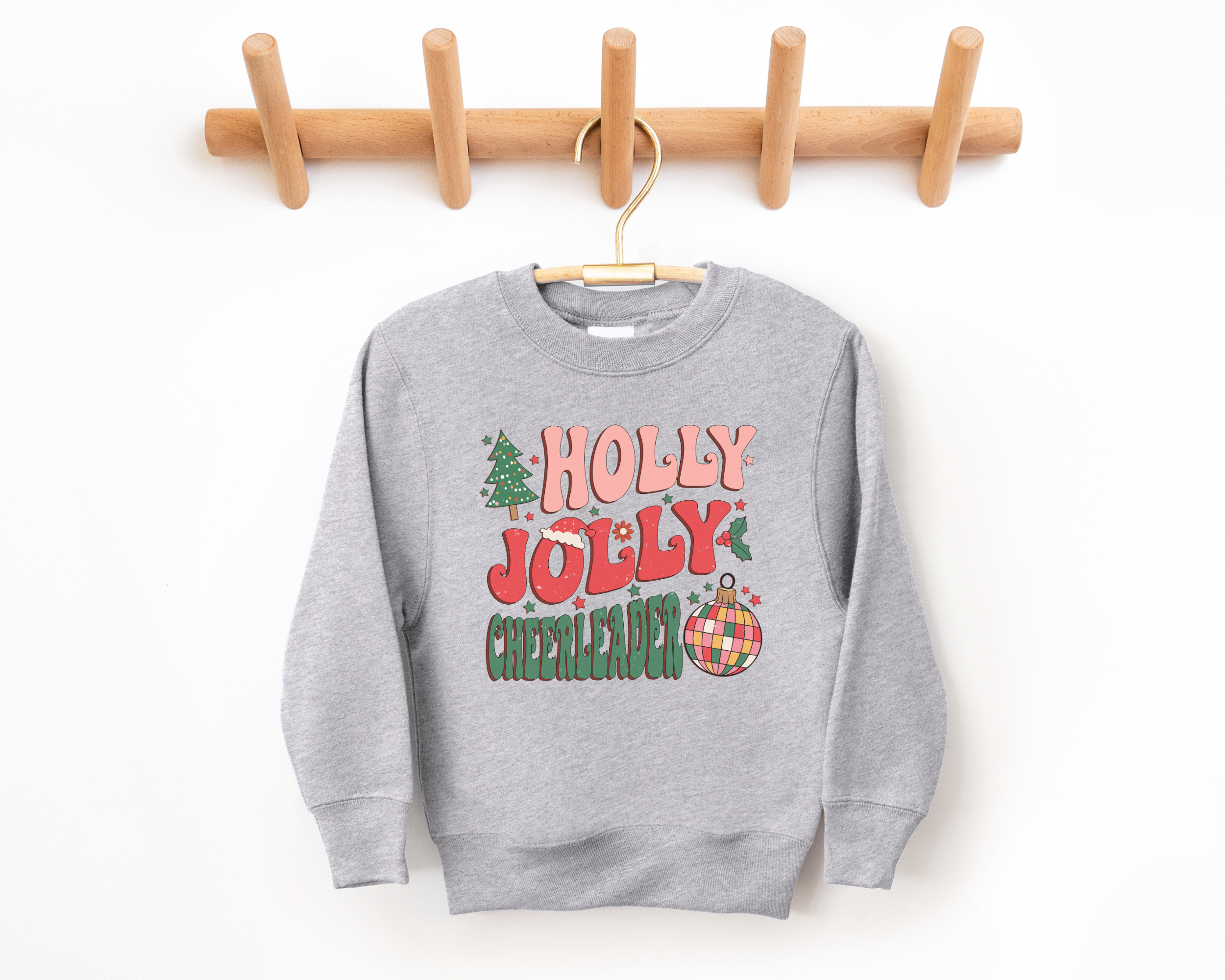 Holly jolly cheerleader sweatshirt for Christmas.  Sized for toddlers, kids, and teens.