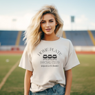 Ivory colored shirt with black design.  It says home plate at the top with 3 lawn chairs  belo and then social club and lastly "weekends are for baseball."  Great shirt for a baseball mom or anyone attending a baseball game.