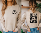 In my soccer mom era.  Soccer mom sweatshirt in sand.